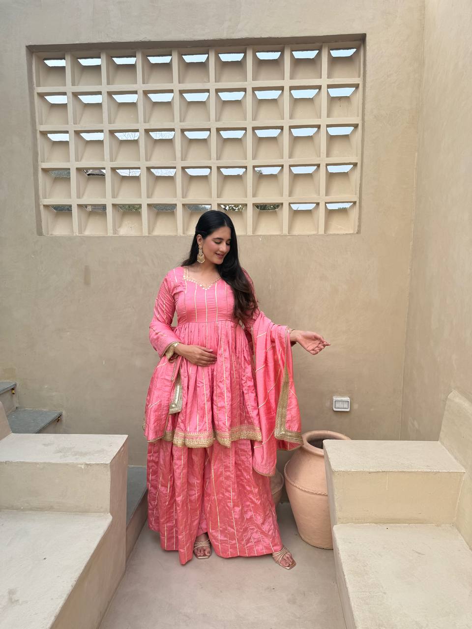 Radiant Rose Pink Flared Peplum Kurti and Sharara Set Embellished with Luminous Gold Zari Stripes and Sequined Borders